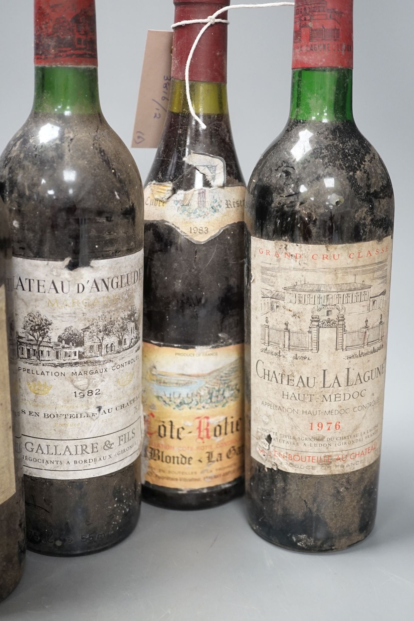 Six various bottles of red wine including two bottles of Château La Lagune 1976 etc.